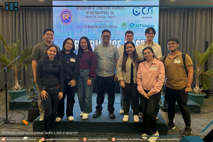 A group of ten members from the structural design team of AC Pama Engineering Consultancy stand together on stage in front of a large digital screen during the Performance-Based Design Seminar in Davao City, March 5, 2026. The backdrop displays the event title and sponsors, with potted plants framing the stage.